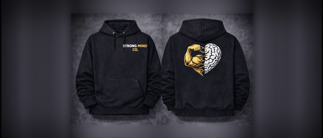 Black hoodie with 'Strong Mind Co.' text on front and fist and brain design on back, on a dark background.
